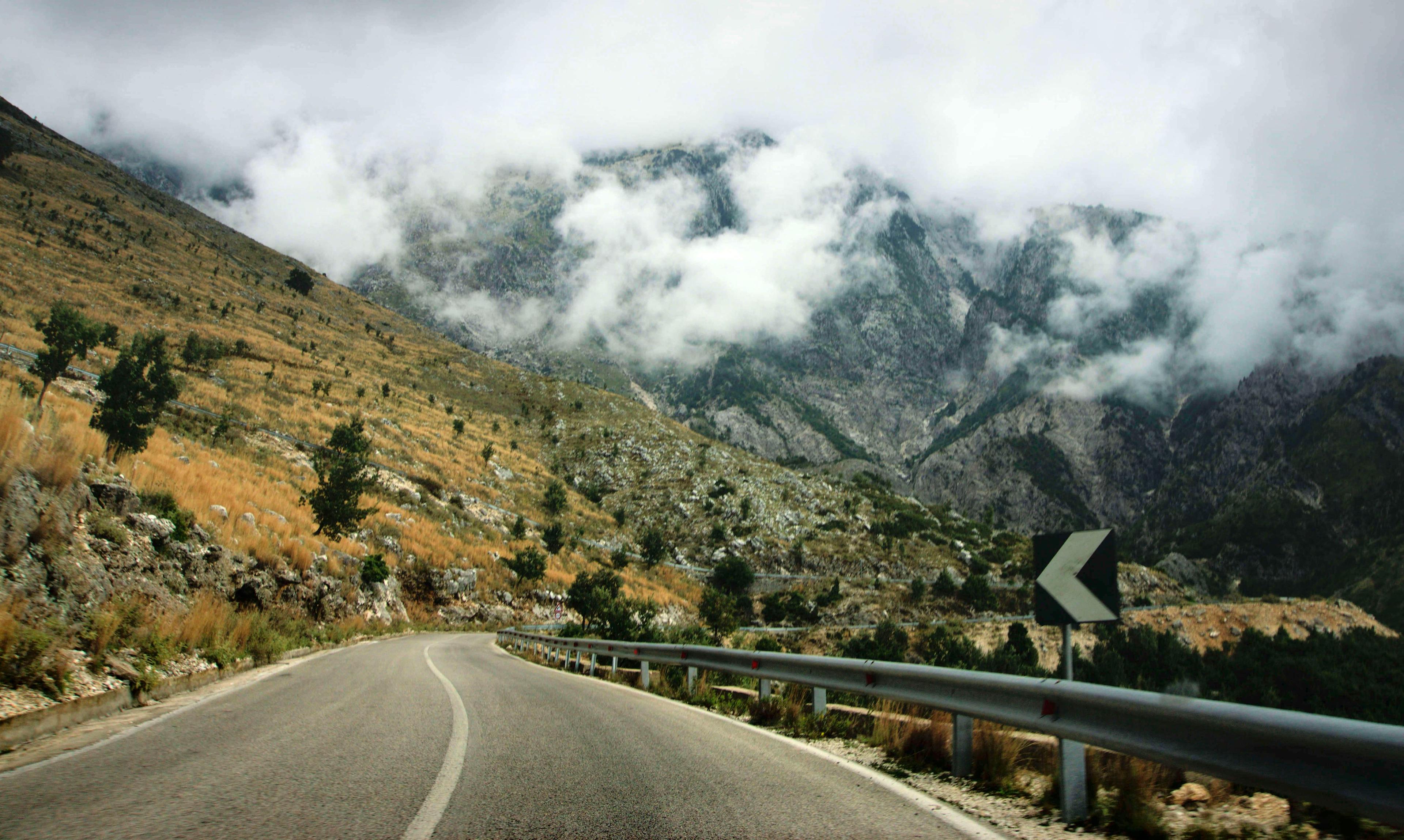 Rental car driving on a scenic road in Albania