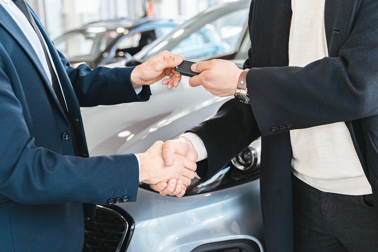 Rental car keys and paperwork on a desk
